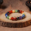 Colorful natural stone beaded bracelet on wooden display, boho gemstone jewelry