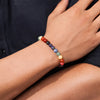 Hand wearing a colorful gemstone beaded bracelet on the wrist