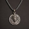 Oxidized silver pendant necklace with intricate lion face design on black background