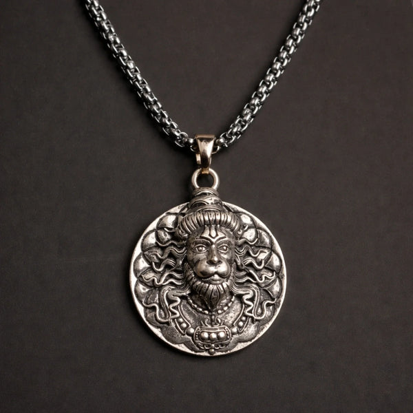 Oxidized silver pendant necklace with intricate lion face design on black background